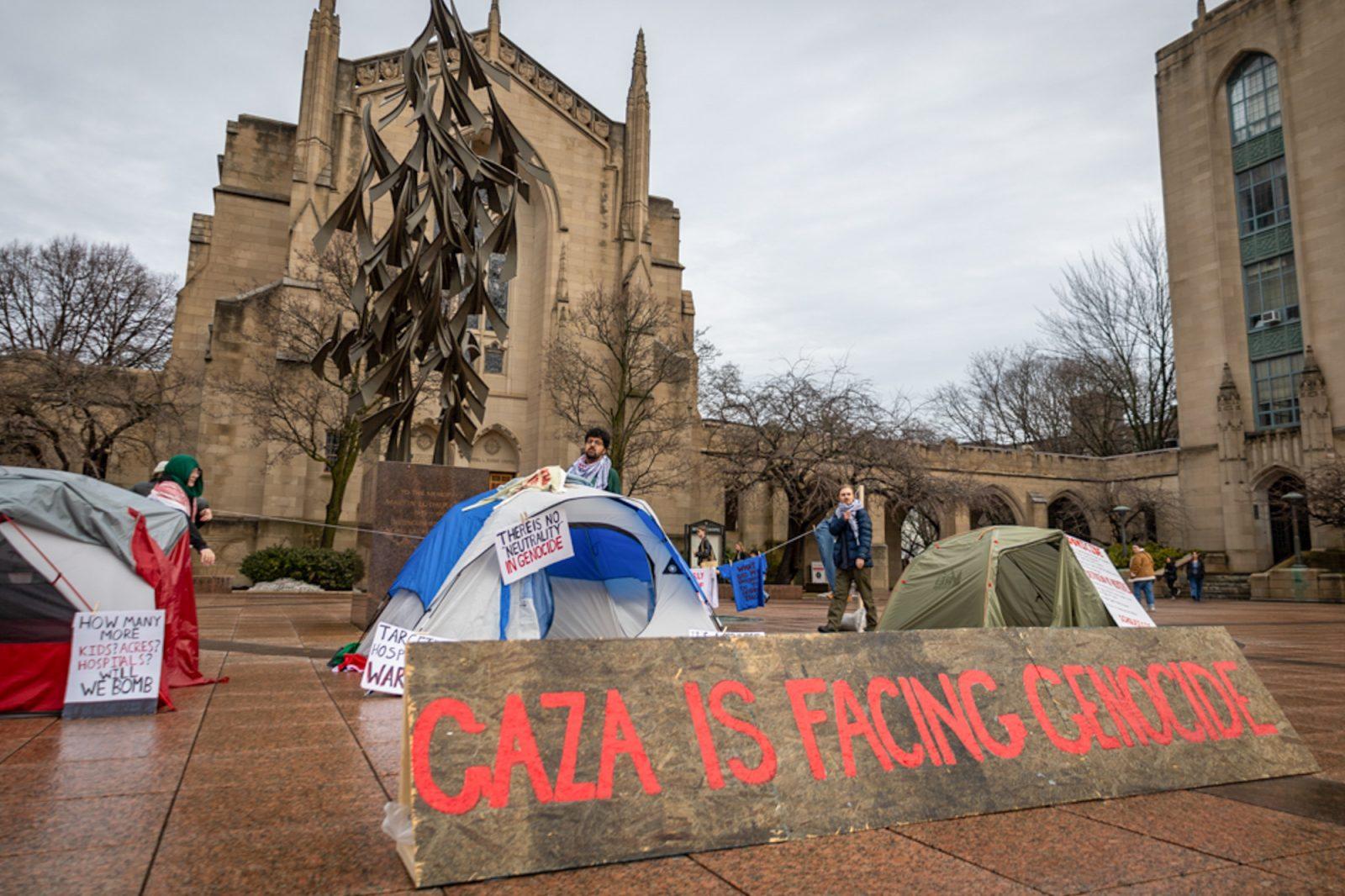 Tents and signs set up on Marsh Plaza in a pro-Palestine demonstration on Thursday. Students for Justice in Palestine set up this display during a “global week of action” to represent the conditions of displaced people in Gaza. MATTHEW EADIE/ DFP PHOTOGRAPHER
