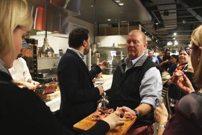 Celebrity chef Mario Batali presents a tray of food to attendees of Eataly Boston’s press event Friday. PHOTO BY BETSEY GOLDWASSER/ DAILY FREE PRESS STAFF 