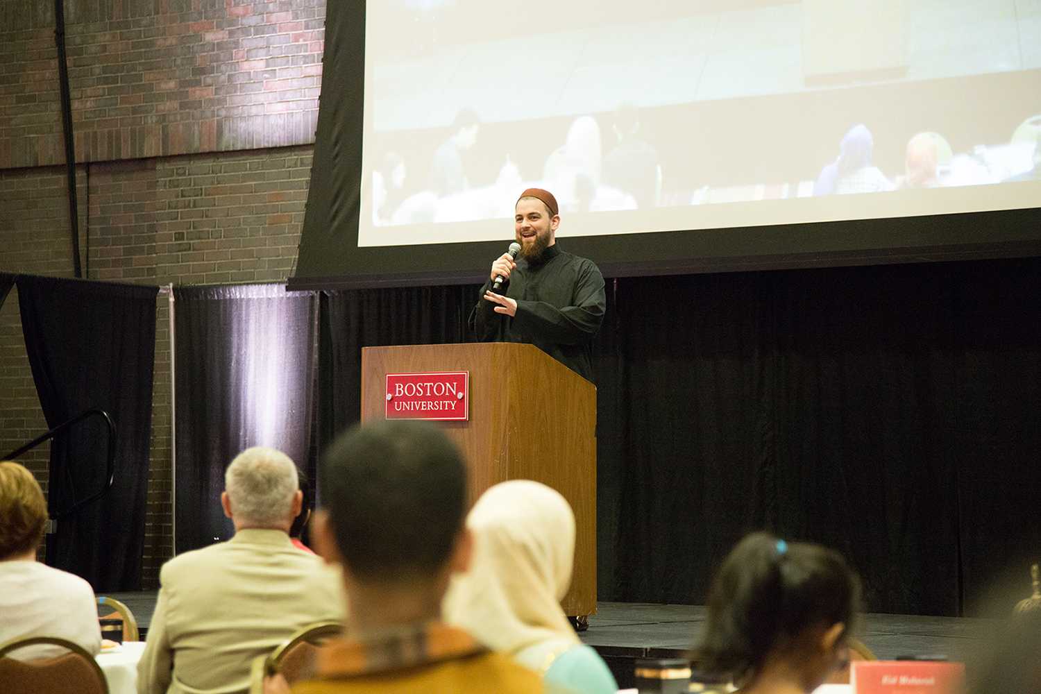 Keynote speaker Ustadh AbdelRahman Murphy speaks at the Boston University Islamic Society's annual Eid-ul-Adha banquet Sunday. PHOTO BY HALEY ABRAM/ DAILY FREE PRESS STAFF
