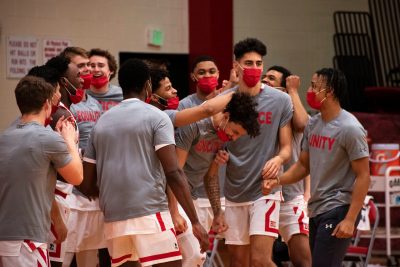 Boston University men's basketball team wearing social justice shirts before a game