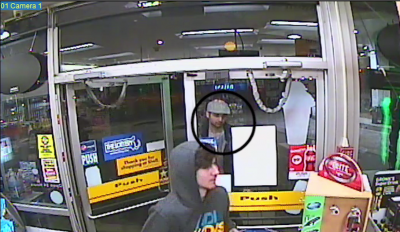 Video footage from inside the Shell gas station mini-mart shows Dzhokhar (hoodie) and Tamerlan (white hat) about to flee the scene after Meng's escape. IMAGE COURTESY OF FBI