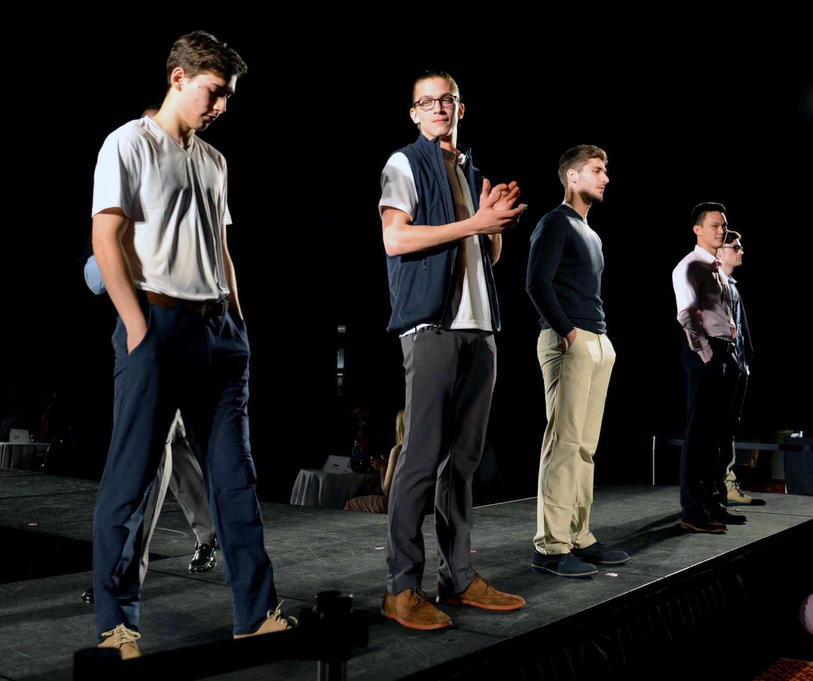 Models show off a line from Ministry of Supply at the Fashion and Retail Association's "Life in Pink" fashion show Saturday at the George Sherman Union Metcalf Ballroom. PHOTO BY HEATHER GOLDIN/DAILY FREE PRESS STAFF