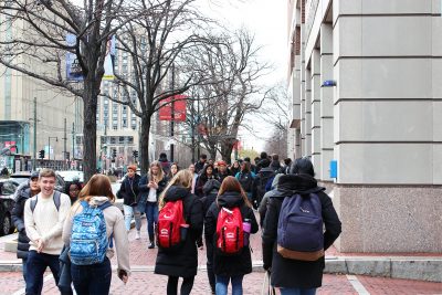 college students walking side