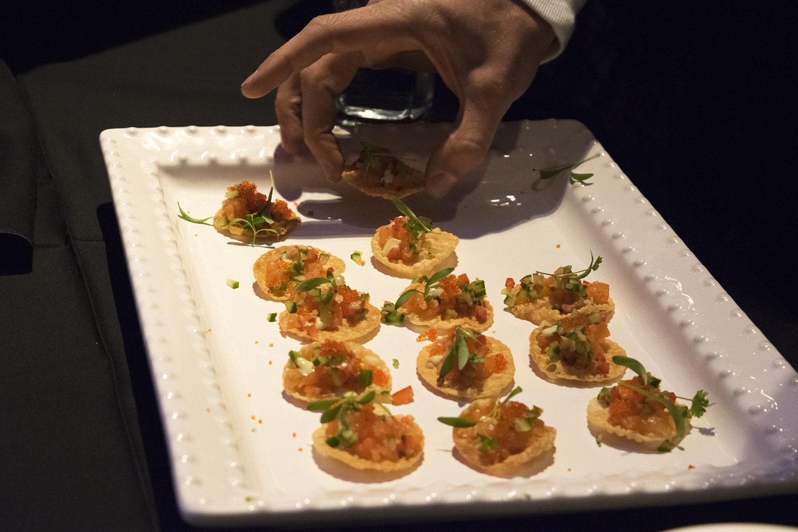 Ippy Aiona’s taretar on wonton crisp is served at the Forbes Under 30 Food Festival Tuesday night. PHOTO BY LAUREN FRIAS/ DAILY FREE PRESS STAFF