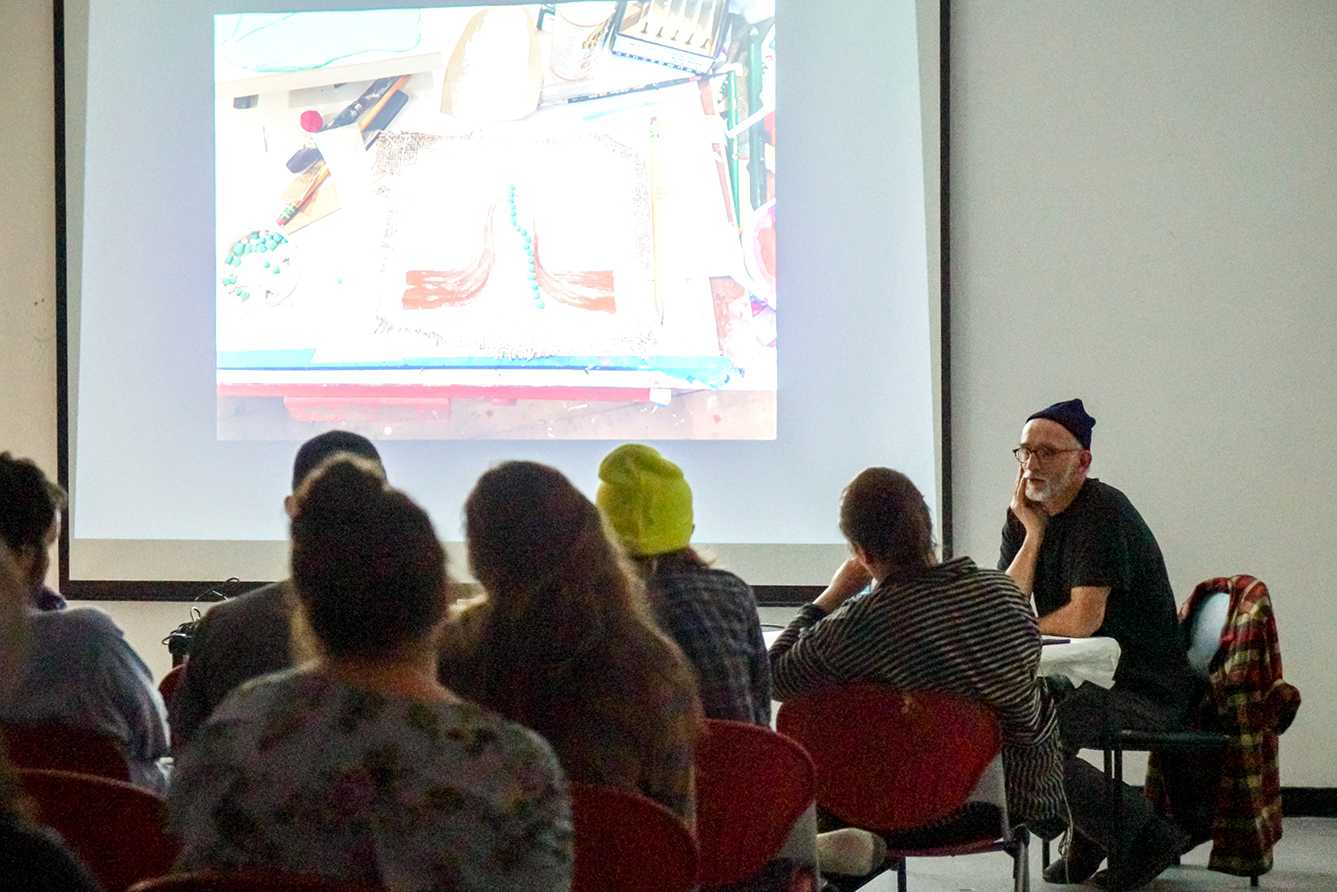 New England-based artist Frank Jackson shares his work with an audience Tuesday night at Boston University’s School of Visual Arts. SERENA YU/ DAILY FREE PRESS STAFF
