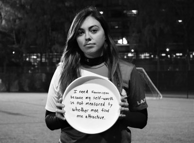 Members of the Boston University ultimate frisbee team pose with phrases from their “I Need Feminism Because...” Facebook campaign. PHOTO COURTESY FACEBOOK