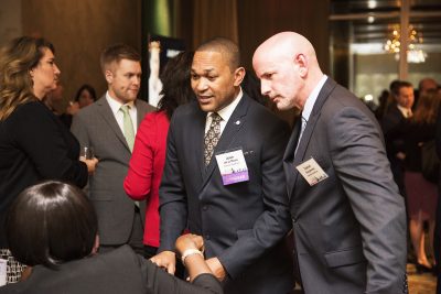 Honoree Jose de la Rosa, CEO of Guardian Healthcare, networks with other attendees of the “Power 50 — The Game Changers” event at the Ritz-Carlton Thursday night. PHOTO BY LEXI PLINE/ DAILY FREE PRESS STAFF