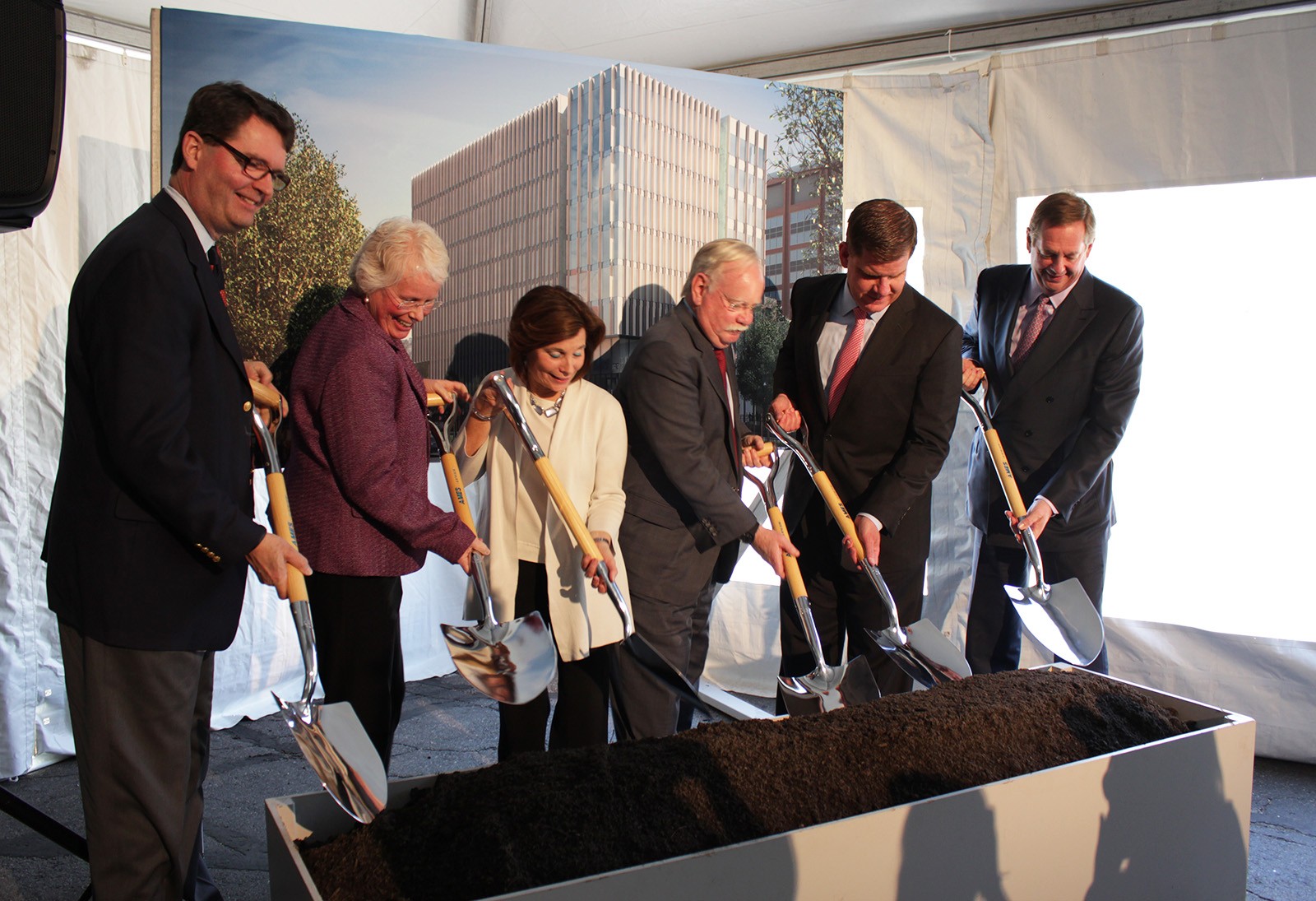 From left, J. Kenneth Menges,  Jean Morrison, Gloria Waters, Boston University President Robert Brown, Boston Mayor Martin Walsh and Robert Knox break ground on Boston University's Center for Integrated Life Sciences and Engineering Thursday. PHOTO BY FELICIA GANS/ DAILY FREE PRESS STAFF