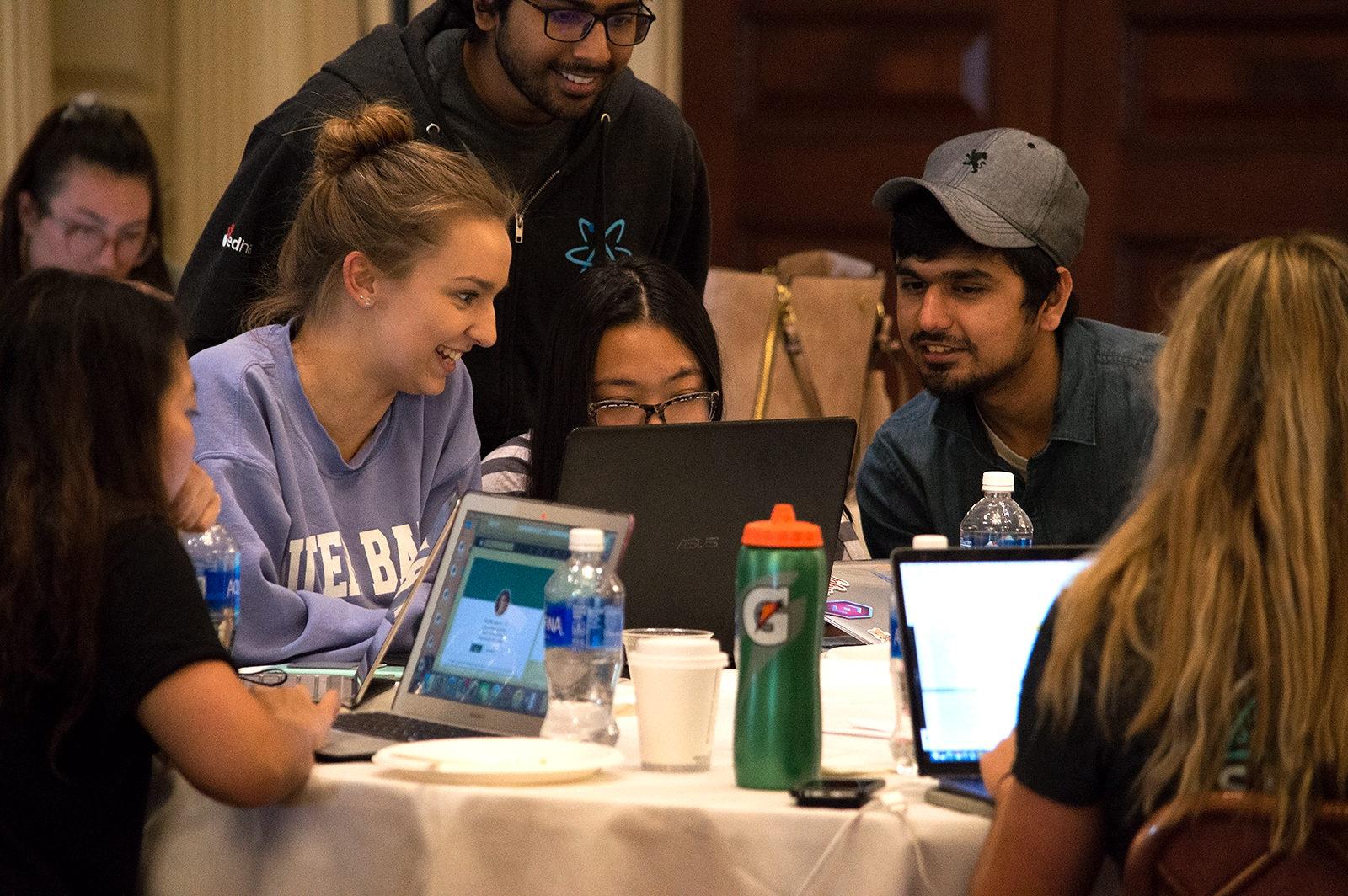 Students practice coding at Girls Who Code BU’s "Hack the Gap" event Sunday afternoon in the Trustee Ballroom. PHOTO BY VIGUNTHAAN THARMARAJAH/ DAILY FREE PRESS STAFF