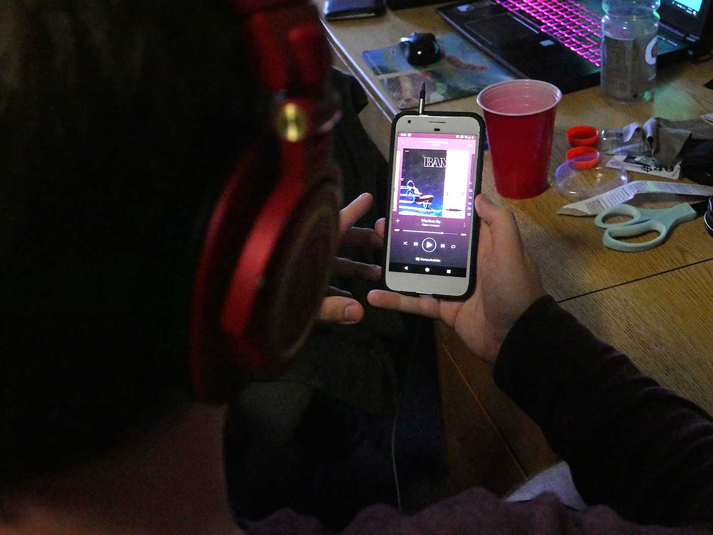 A Spotify user listens to “Bambi,” the latest album from indie rock band Hippo Campus. ILLUSTRATION BY FELIX PHILLIPS/ DAILY FREE PRESS STAFF