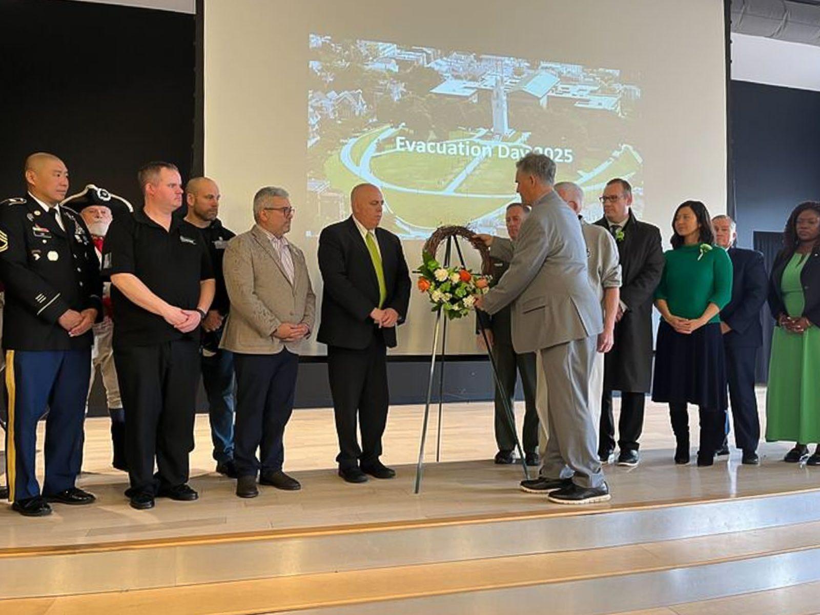 A wreath is presented at the South Boston Citizens Association’s Evacuation Day Historical Exercises. Mayor Michelle Wu spoke at the event which celebrated the departure of British troops from Dorchester Heights in 1776. PHOTO BY SARA CREATO 