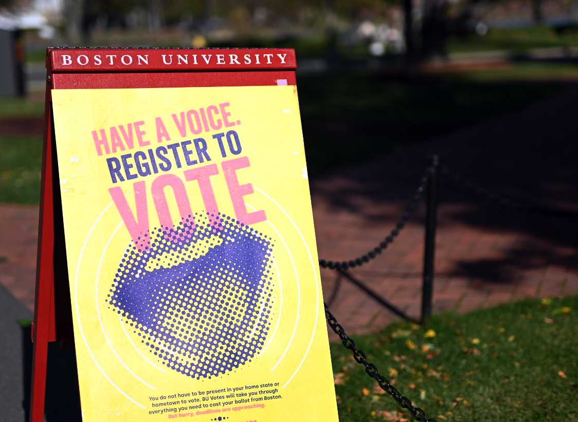 A sign near the Boston University Beach encouraging students to register to vote. College students have lower voter turnout than any age group, which may be exacerbated by COVID-19 and difficulties with voter registration. LAURYN ALLEN | DAILY FREE PRESS STAFF


