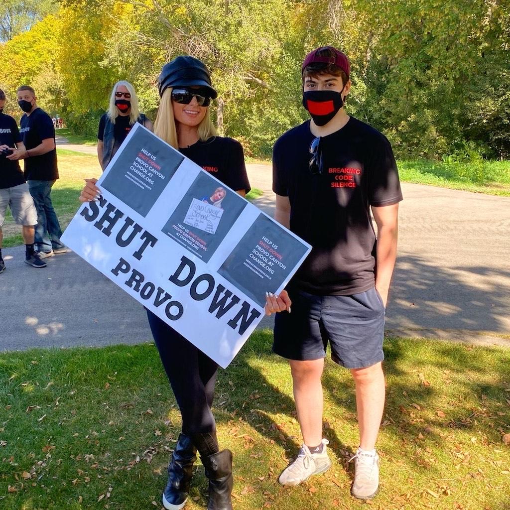 Boston University College of Arts and Sciences senior Josh Prinzo poses with Paris Hilton at a protest supporting the #BreakCodeSilence movement aimed at supporting survivors of the troubled team industry. COURTESY OF JOSH PRINZO
