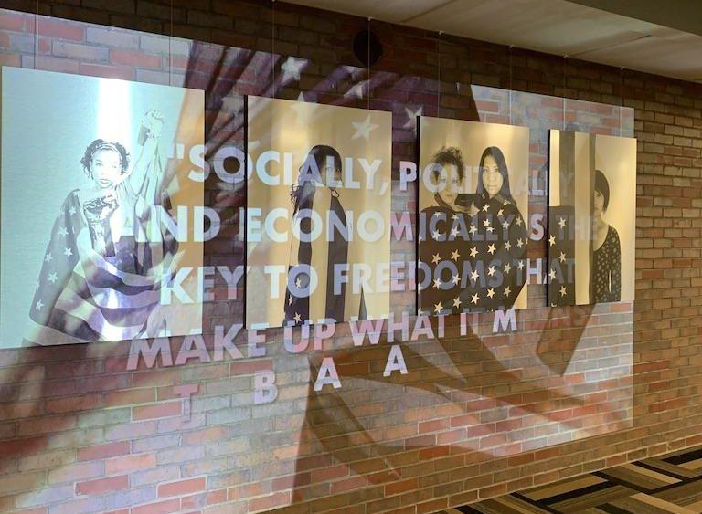“Re-Birth” photographer Sheila Pree Bright’s multi-photograph installation hangs on a wall of Boston University’s Mugar Memorial Library. NICOLE BARTUCH / DAILY FREE PRESS STAFF