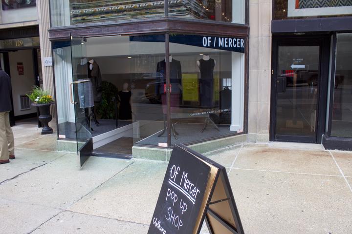 An Of Mercer employee organizes clothing at the pop-up shop. PHOTO BY MAGGIE LEONE/ DAILY FREE PRESS STAFF