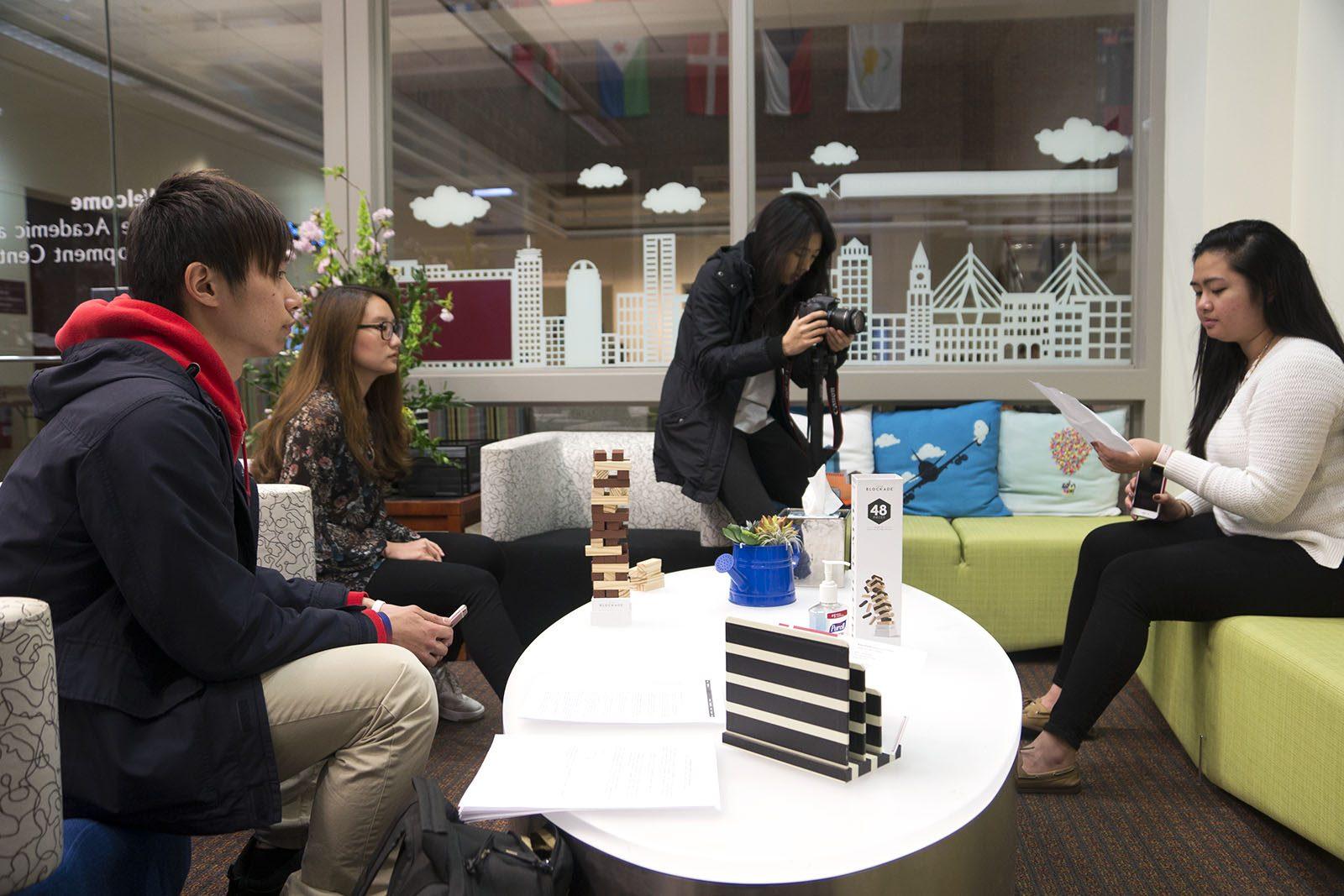 Questrom students Reo Osawa and Judy Phyu interview Questrom senior Korinne Dizon on Monday afternoon as a collaboration with Boston University’s Community Service Center to raise awareness of people’s varying definitions of food insecurity. PHOTO BY SYDNEY MAES/ DAILY FREE PRESS STAFF