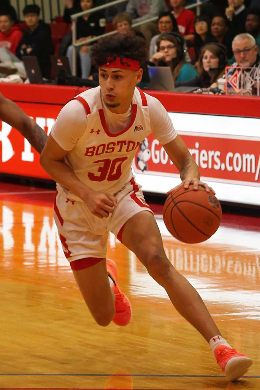 Boston University point guard Javante McCoy driving to the paint against Colgate