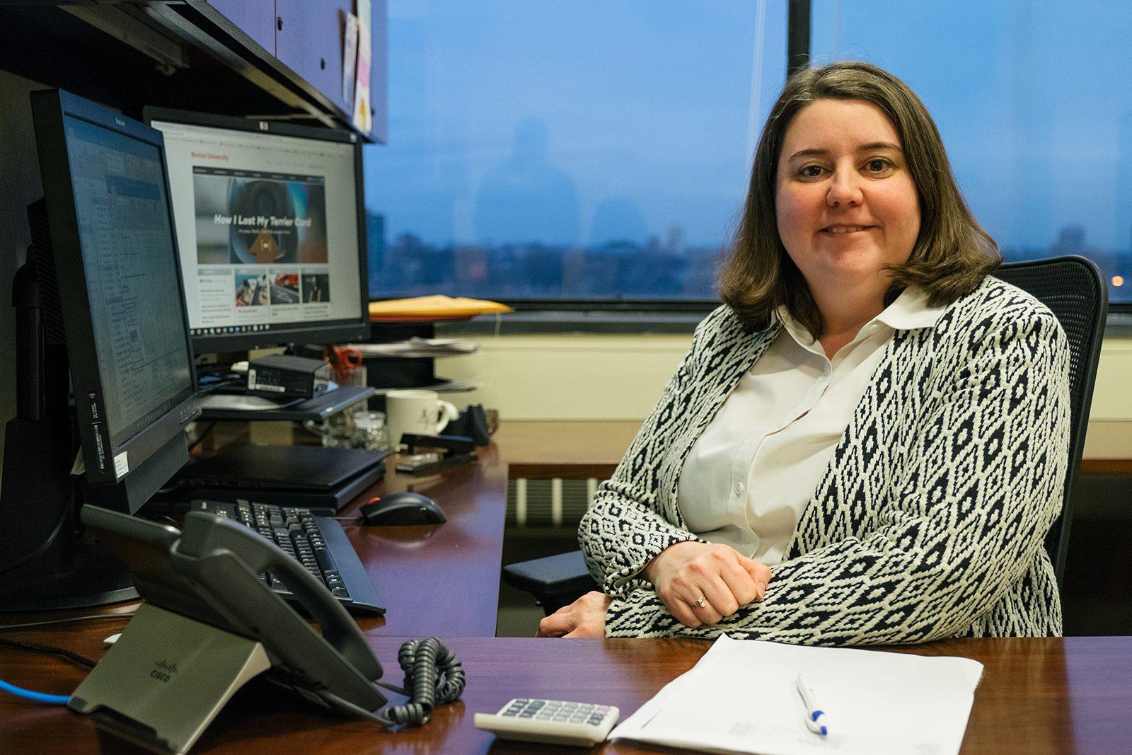 Julie Wickstrom, associate director of Financial Assistance at Boston University, sits at her desk in the financial aid office. PHOTO BY BRIAN SONG/ DAILY FREE PRESS STAFF