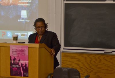 Cathy Cohen of the University of Chicago speaks about activism in black queer politics Tuesday evening in the Kenmore Classroom Building. PHOTO BY CHLOE GRINBERG/ DAILY FREE PRESS STAFF