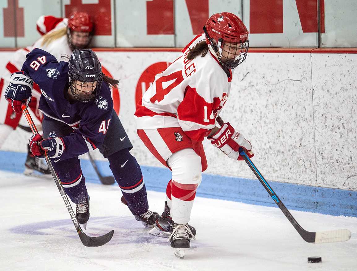 Kristina Schuler takes the puck up the ice versus UConn