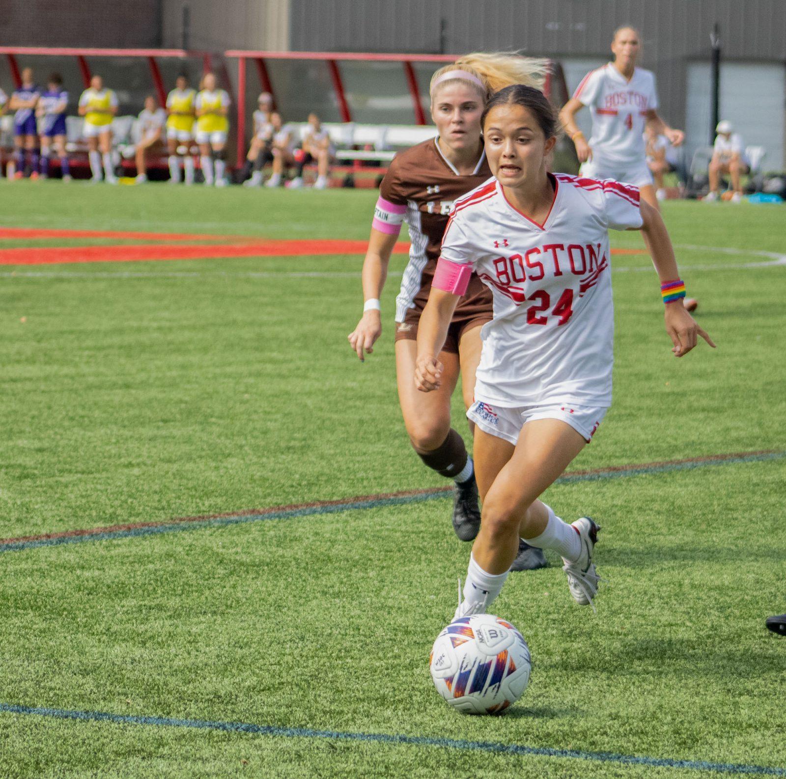 Graduate student midfielder Lily Matthews (24) runs with the ball in a game against Lehigh University on Saturday. The Terriers won against Lehigh 6-1, which allowed them rise to second in the Patriot League standings. TALIA LISSAUER/DFP PHOTOGRAPHER