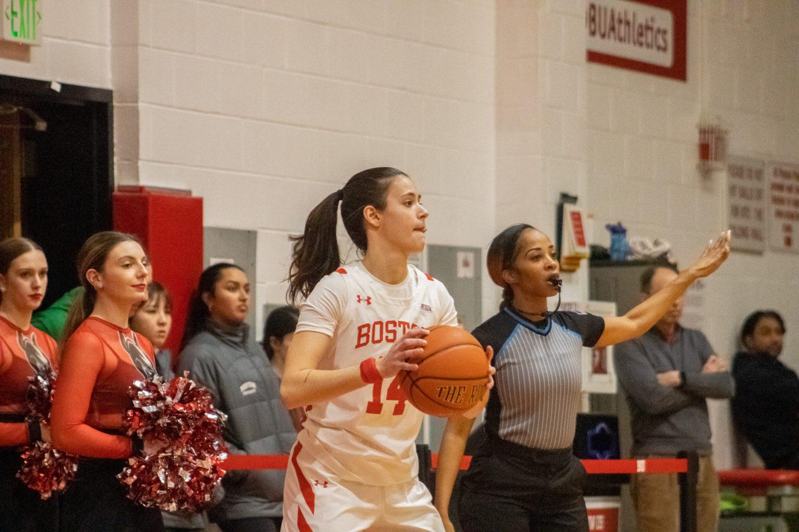 Sophomore guard Inés Monteagudo Pardo (14) looks to pass the ball during a game on Feb. 1. The Boston University women’s basketball team honored its graduating seniors before a game against American University Saturday. TALIA LISSAUER/DFP PHOTOGRAPHER 