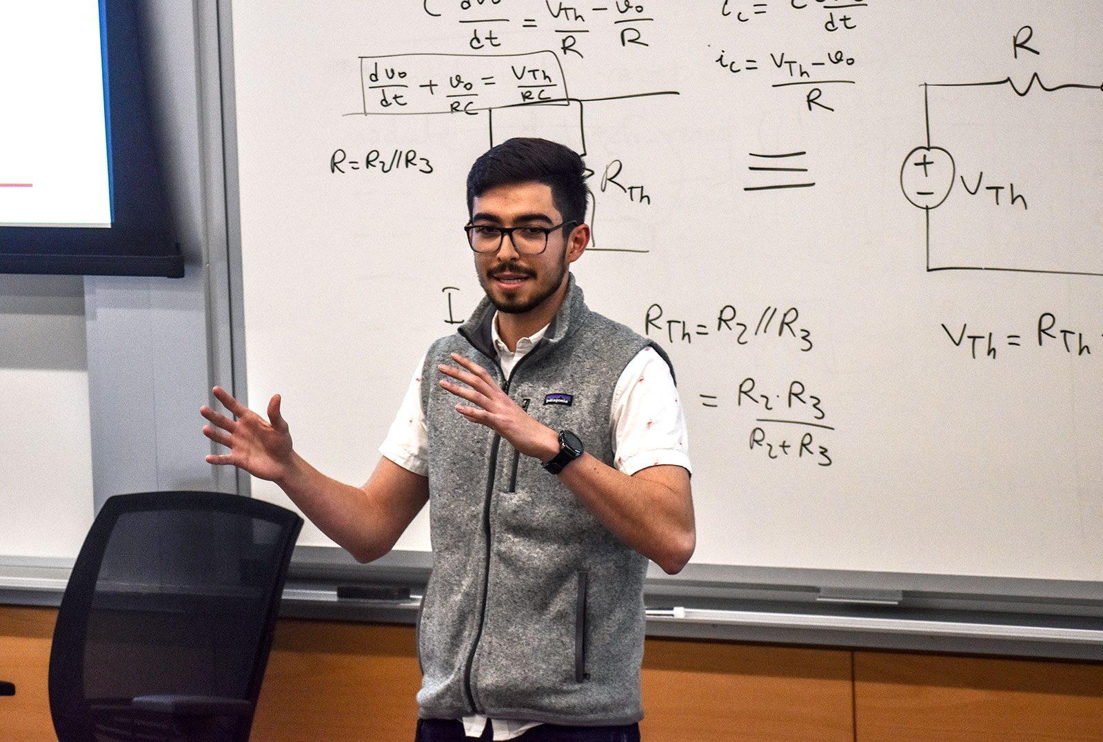 Vice President of Finance Lukas Flores speaks to the Undergraduate Student Government about the current budget at Monday night’s meeting. LAURYN ALLEN/ DAILY FREE PRESS STAFF