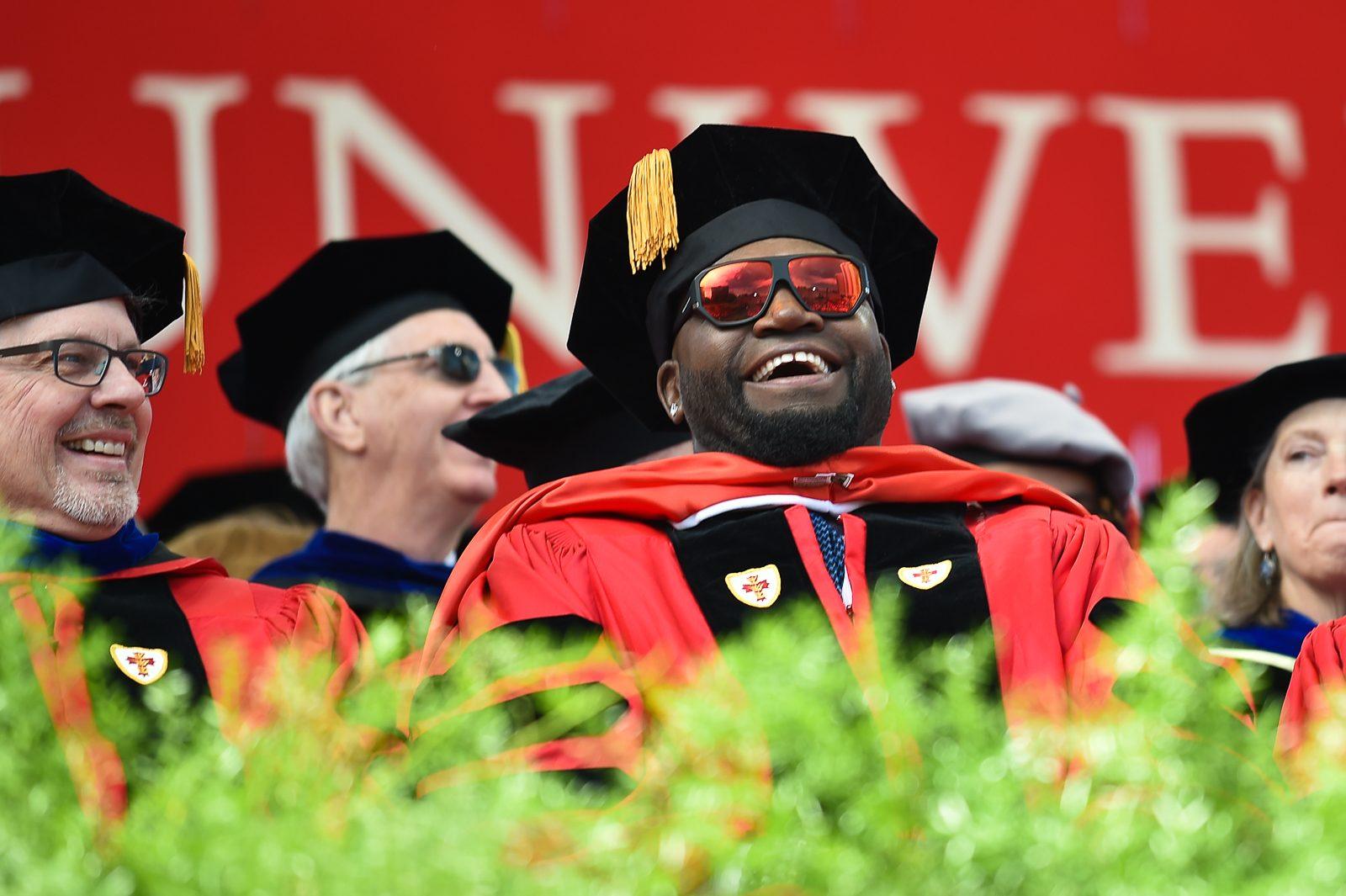 Former star of the Boston Red Sox and philanthropist David Ortiz laughs on stage during Boston University’s commencement Sunday afternoon on Nickerson Field. PHOTO BY MADDIE MALHOTRA/ DAILY FREE PRESS STAFF