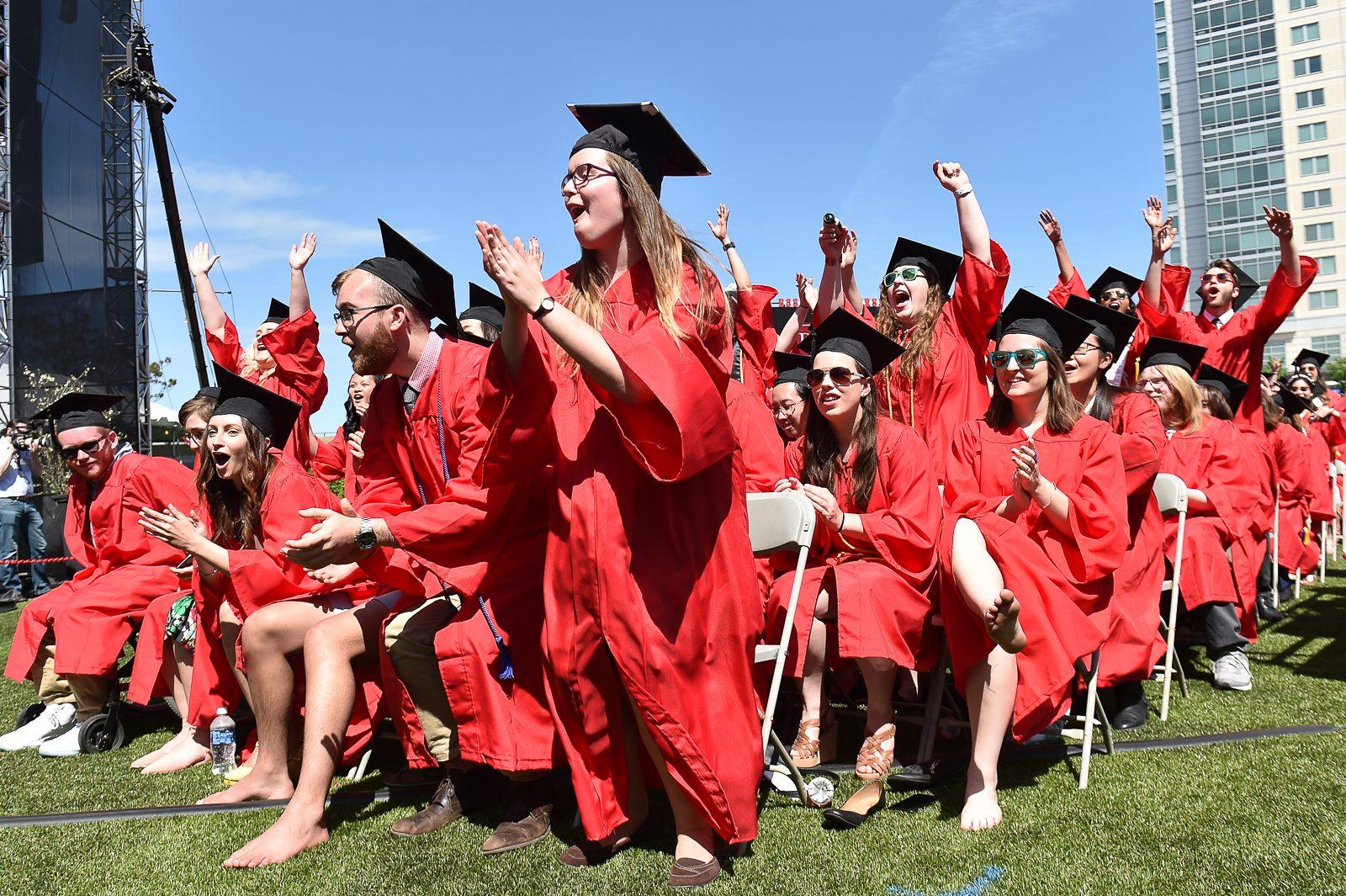 Graduates rise from their seats as their degrees are officially conferred during Boston University’s All-University Commencement Ceremony Sunday afternoon. PHOTO BY MALHOTRA/ DAILY FREE PRESS STAFF