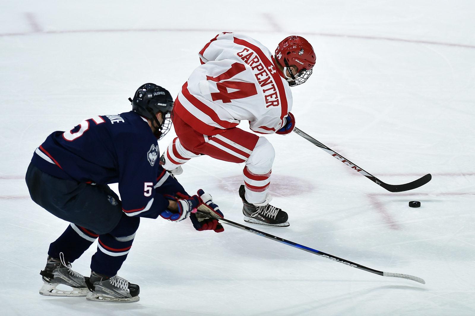 Bobo Carpenter drives against a UConn defender. PHOTO BY MADDIE MALHOTRA/ DAILY FREE PRESS STAFF 