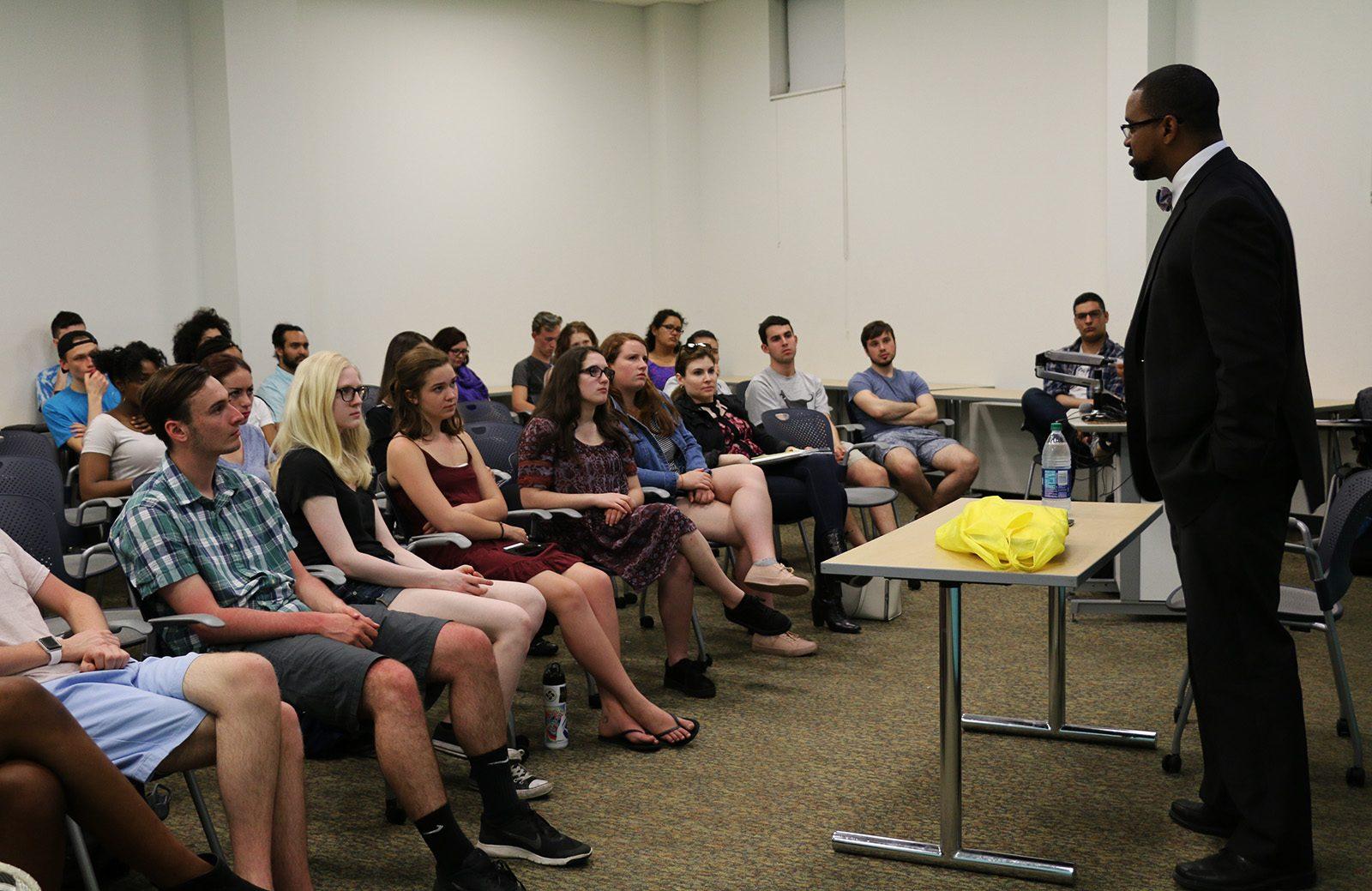 Northeastern University student organizations bring Rahsaan Hall, who leads the ACLU of Massachusetts's Racial Justice Program, to their school on Tuesday night. PHOTO BY MARIA CASTILLO/ DAILY FREE PRESS STAFF