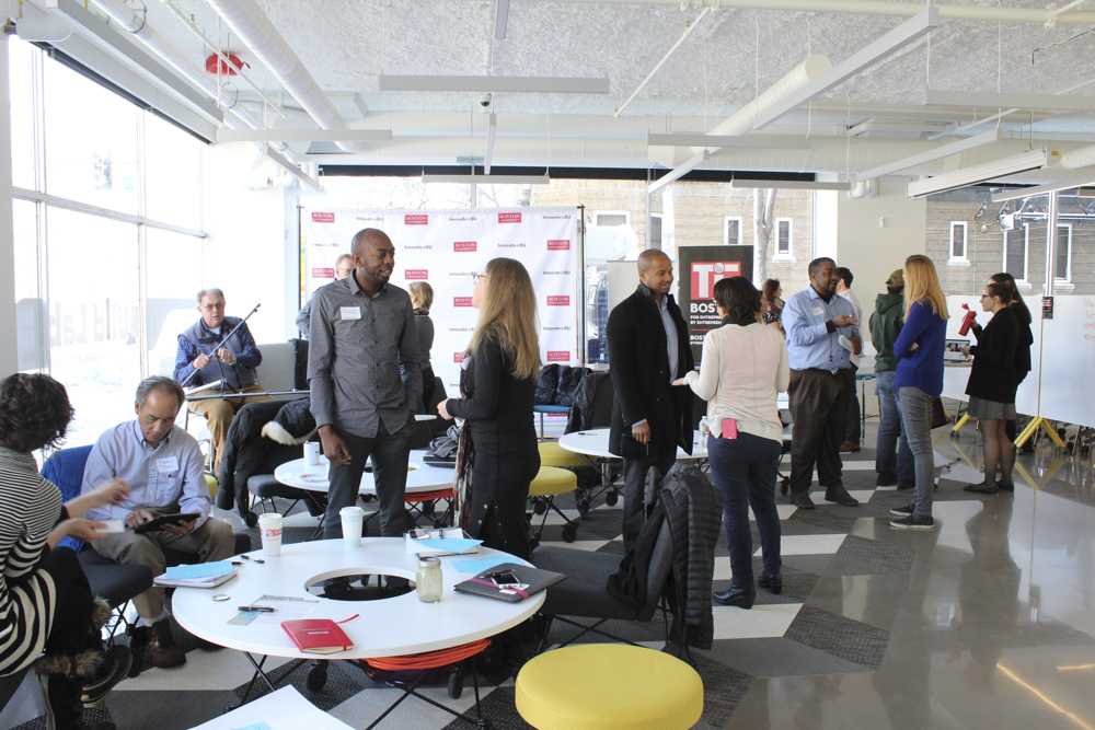 People interact at the 1Million Cups Boston event at the BUild Lab on Wednesday morning. This was the first of a series of monthly meetings held every first Wednesday of the month. PHOTO BY JENNA MANTO/ DAILY FREE PRESS STAFF 

