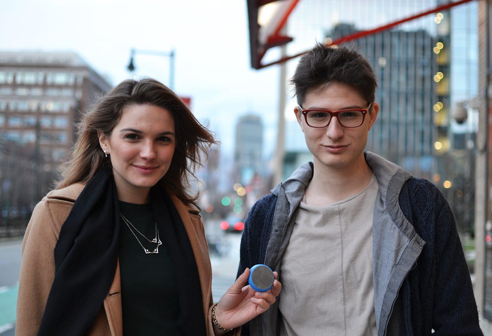 Massachusetts Institute of Technology students Victoria Gregory and Gabe Alba are inventors of the Coffee Cookie, a circular device that heats up reusable coffee cups. PHOTO BY CHLOE GRINBERG/ DAILY FREE PRESS STAFF