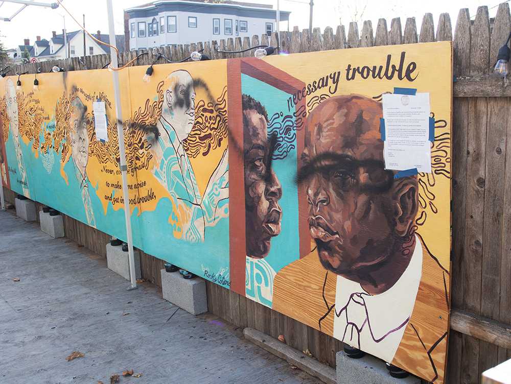 A mural of the late Rep. John Lewis in North Cambridge was vandalized on Monday night. DANIEL KOOL/ DAILY FREE PRESS STAFF