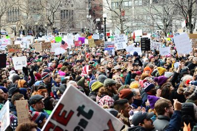 A crowd of protesters marches at the Boston Protest Against Muslim Ban and Anti-Immigration Orders in Copley Square. PHOTO BY VIGUNTHAAN THARMARAJAH/ DAILY FREE PRESS STAFF
