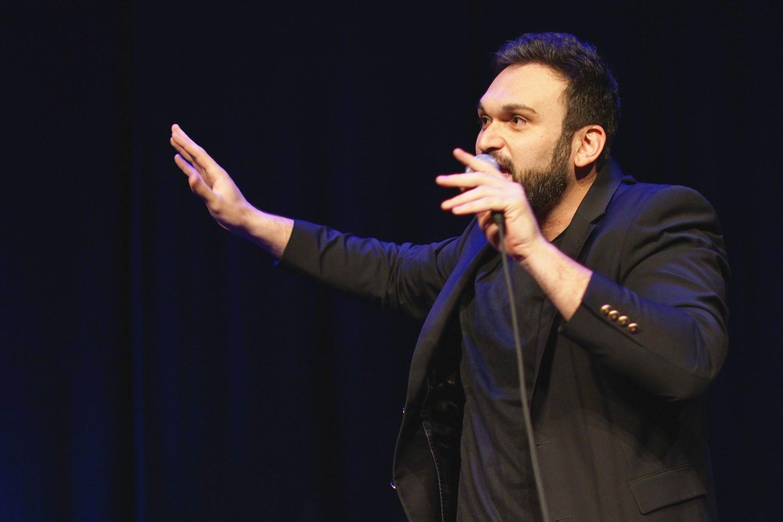 Nemr, a Lebanese-American stand-up comedian, performs his act at the Wilbur Theatre Saturday night. PHOTO BY ALEXANDER NOVAKOVIC/ DAILY FREE PRESS STAFF