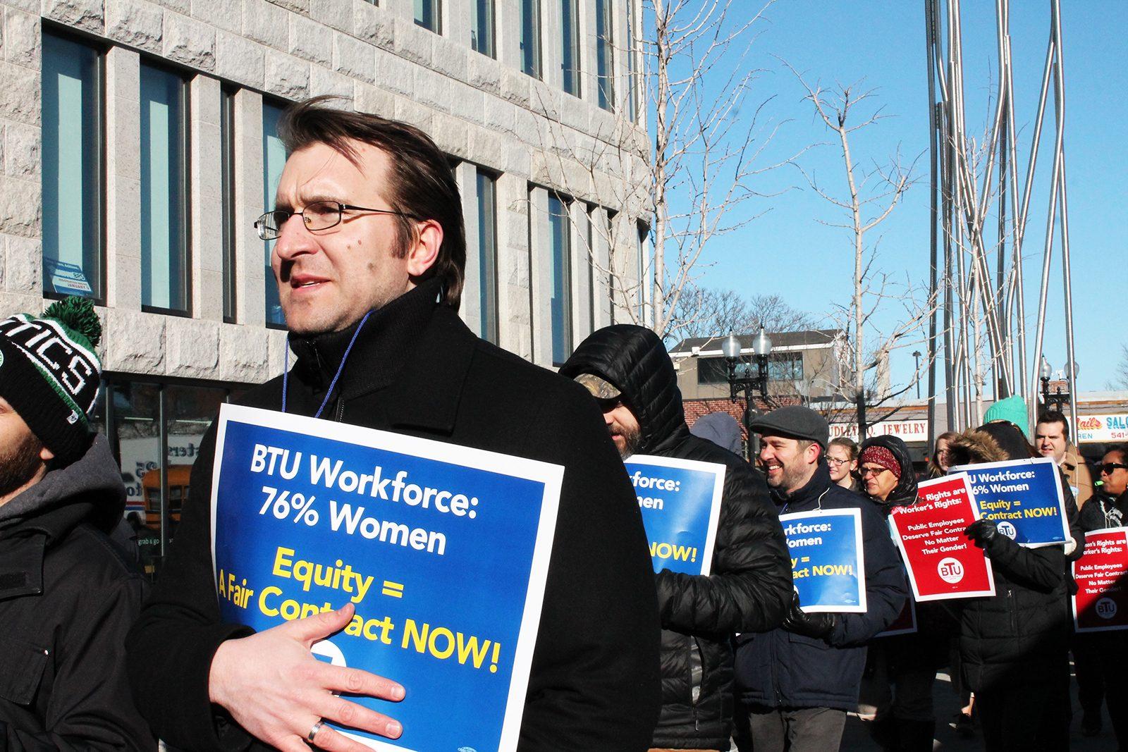 Members of the Boston Teachers Union gather Wednesday night at the Bruce C. Bolling Municipal Building to fight for better working conditions. PHOTO BY NOOR ADATIA/ DAILY FREE PRESS STAFF
