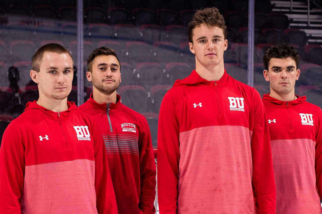From left to right: senior forward Bobo Carpenter, junior defenseman Chad Krys, junior goaltender Jake Oettinger and junior defenseman Dante Fabbro. Carpenter and Fabbro will lead the team during the 2018–19 season.