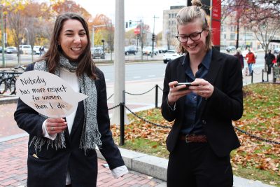 Dressed in pantsuits, Mia Cirker (CAS ’18) and Annette Jensen, an exchange student from Denmark, talk in front of outside of the George Sherman Union. PHOTO BY ABBY FREEMAN/ DAILY FREE PRESS STAFF