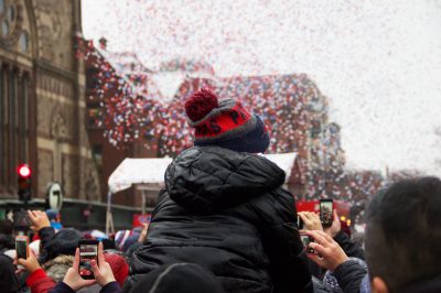 Patriots fans celebrate the team's fifth Super Bowl title at the parade on Tuesday. PHOTO BY OLIVIA FALCIGNO/ DAILY FREE PRESS STAFF