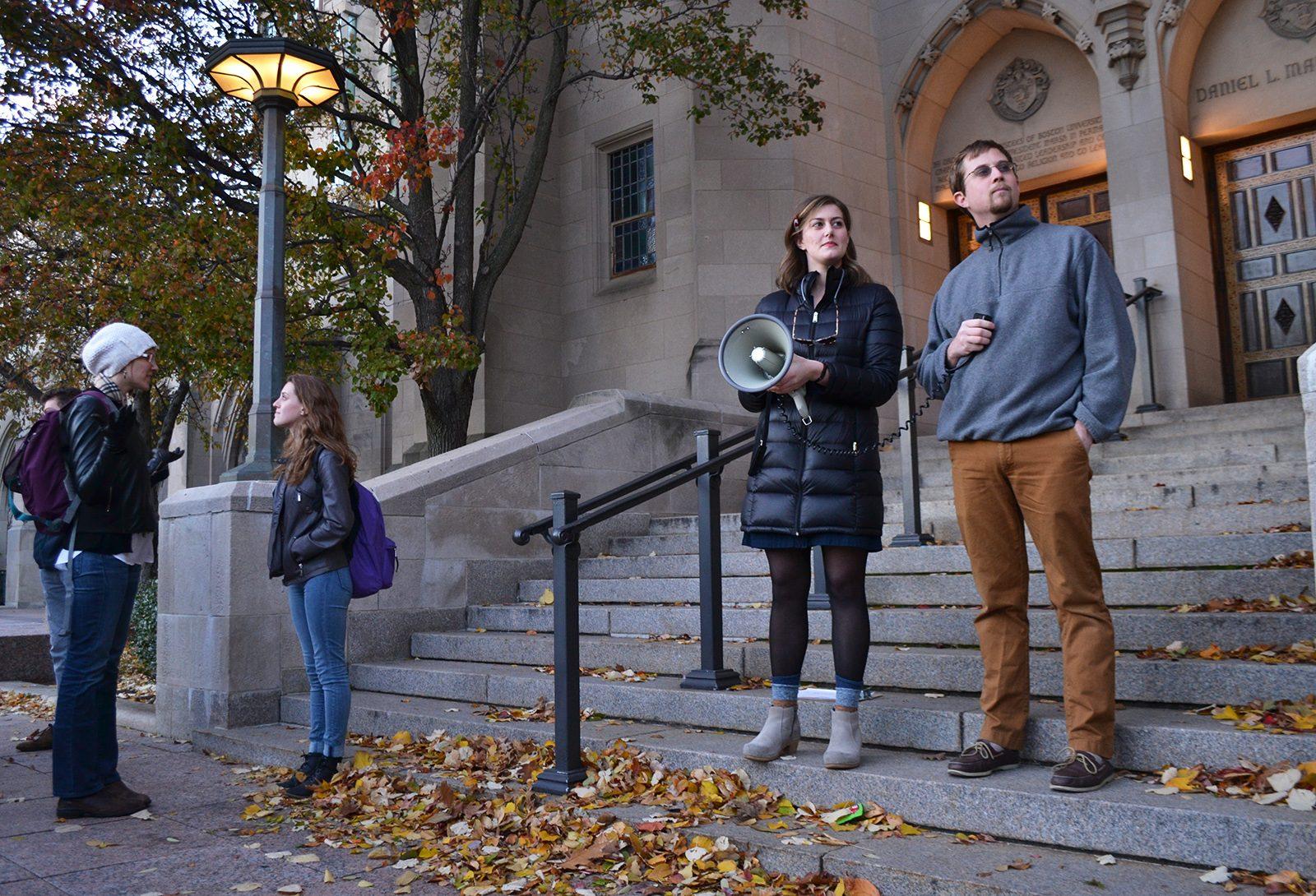 Chloe Hite and Lawrence Whitney address the crowd during a peaceful protest advocating for human rights Friday afternoon in Marsh Plaza. The gathering was hosted by Hoochie, a feminist journal at Boston University. PHOTO BY CHLOE GRINBERG/ DAILY FREE PRESS STAFF