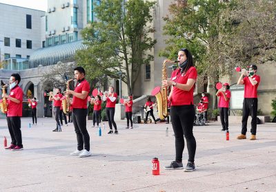 Boston university pep band performs in marsh plaza