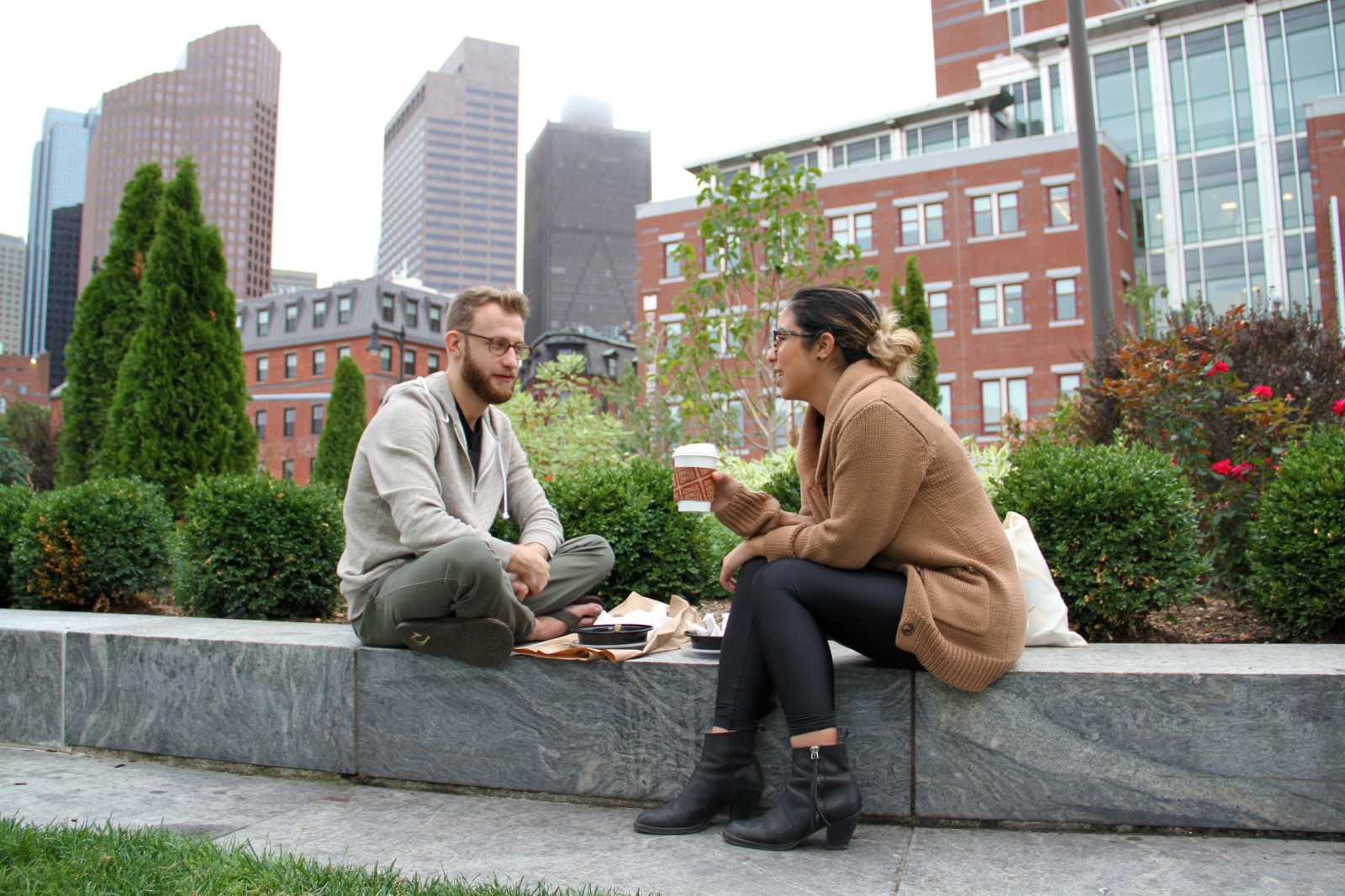 Alex Miller and Ashley Wood of Cambridge enjoy food from the Boston Public Market on Sunday. PHOTO BY SARAH SILBIGER/DAILY FREE PRESS STAFF