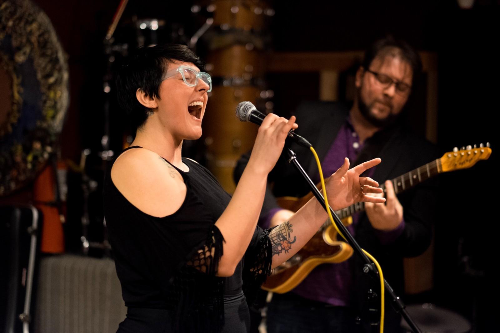 Heather Woods and her husband perform an impromptu set at the Power of Disbelief concert. PHOTO BY BRIAN SONG/DAILY FREE PRESS STAFF