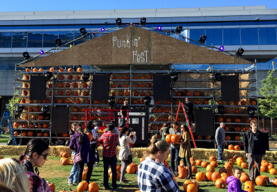 Attendees pass through the “Punkin’ Manor”at Pumpkin' Fest at The Lawn on D Saturday. PHOTO BY MARY SCHLICHTE/DAILY FREE PRESS STAFF