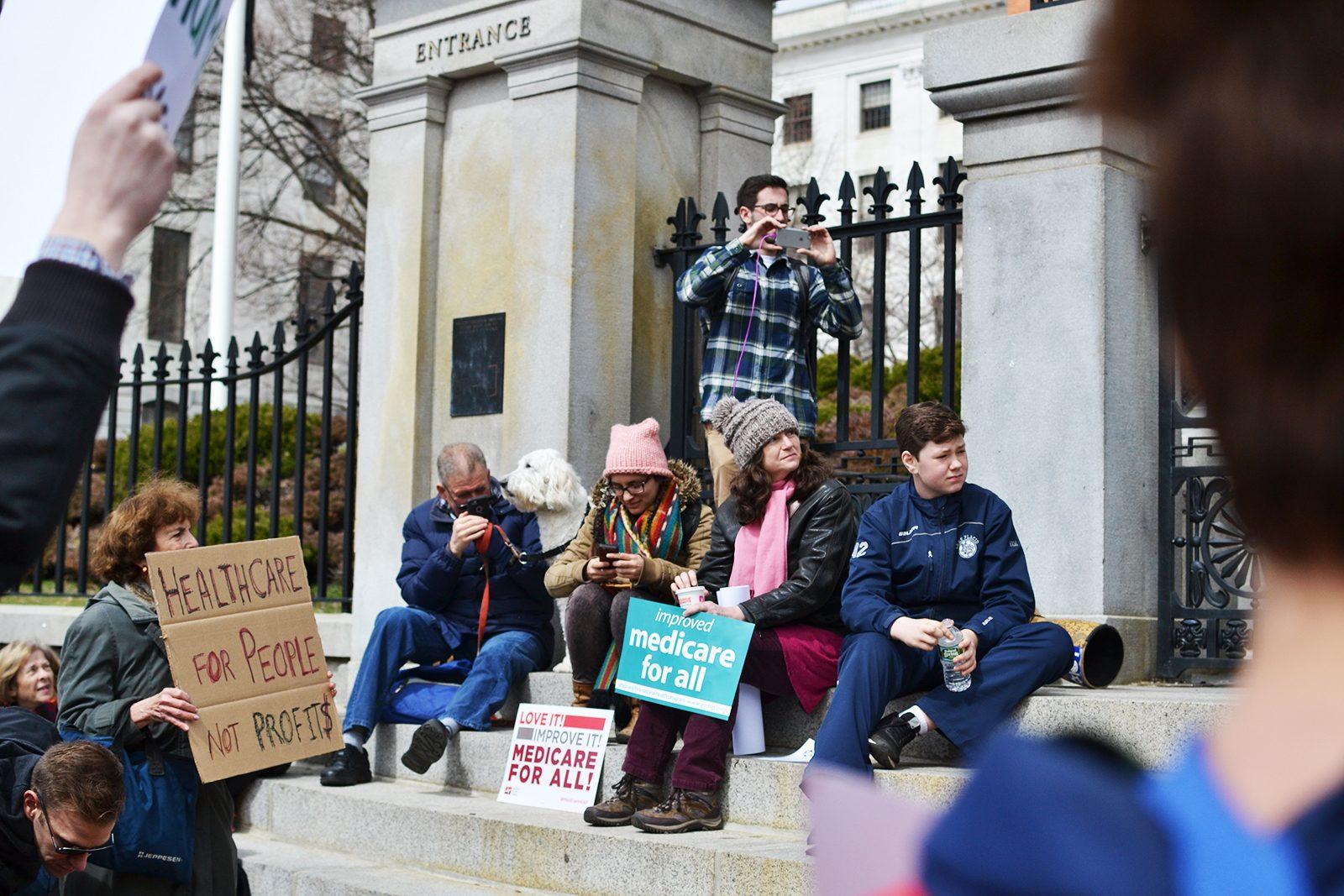 Non-profit groups gather at the Massachusetts State House Saturday afternoon to advocate for the right to health. PHOTO BY CHLOE GRINBERG/ DAILY FREE PRESS STAFF