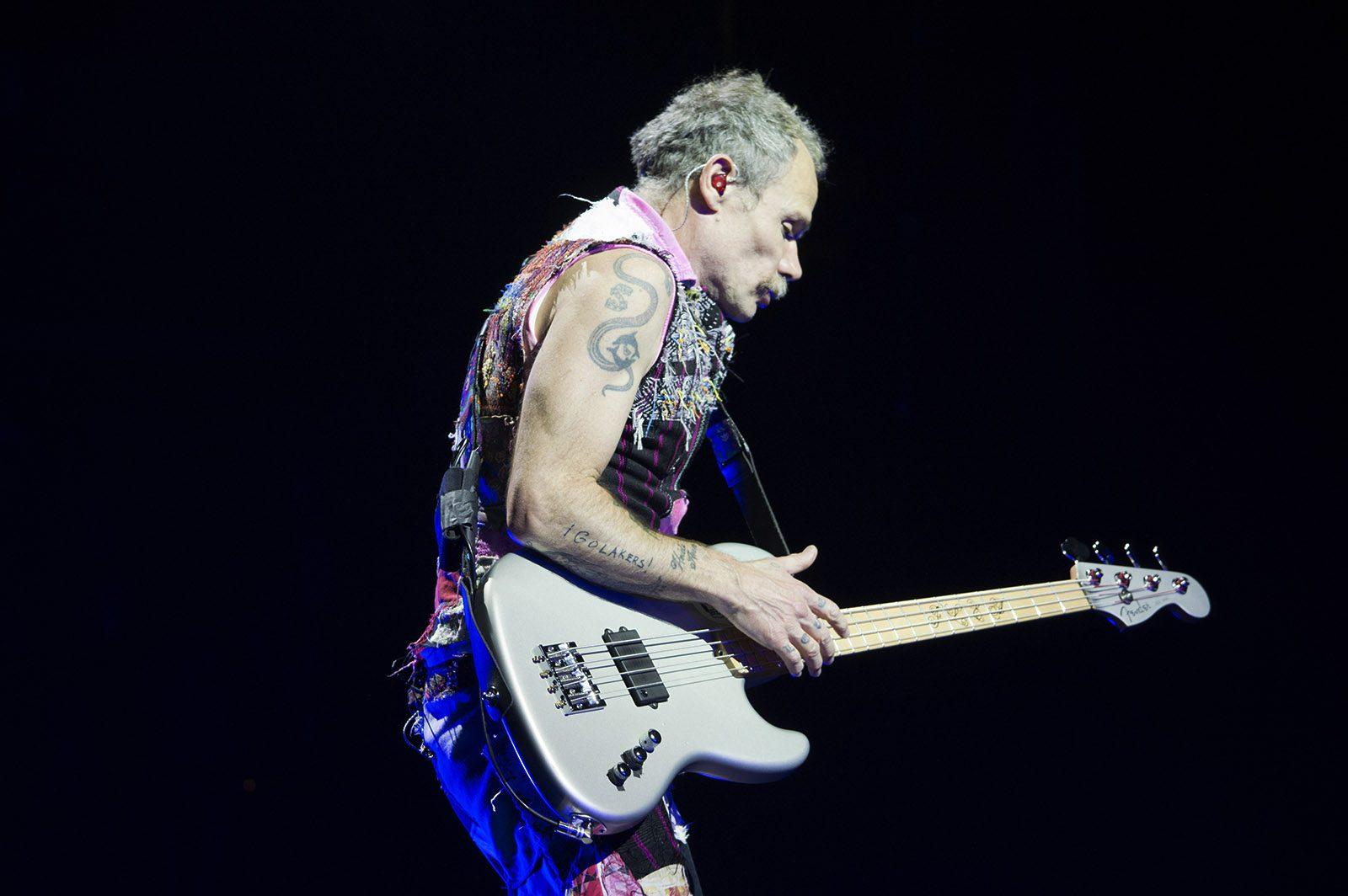 Flea, bassist of the Red Hot Chili Peppers, plays to a cheering crowd. PHOTO BY VIGUNTHAAN THARMARAJAH/ DAILY FREE PRESS STAFF