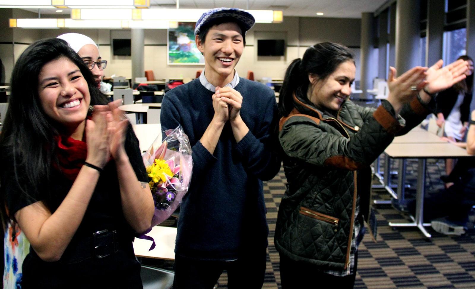 Kimberly Barzola (CAS ’17), Andrew Cho (CAS ’16) and Melesilika Finau (CAS ’17) celebrate in the George Sherman Union Wednesday after hearing that they won the election for Student Government executive board. PHOTO BY SARAH SILBIGER/DAILY FREE PRESS STAFF