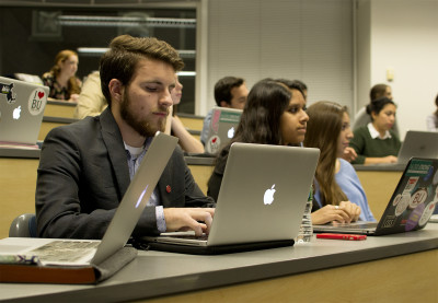 Vice Chair of Senate and College of Arts and Sciences Senator Daniel Collins types notes during the Boston University Student Government Senate meeting Monday night. PHOTO BY LEXI PLINE/DAILY FREE PRESS CONTRIBUTOR 