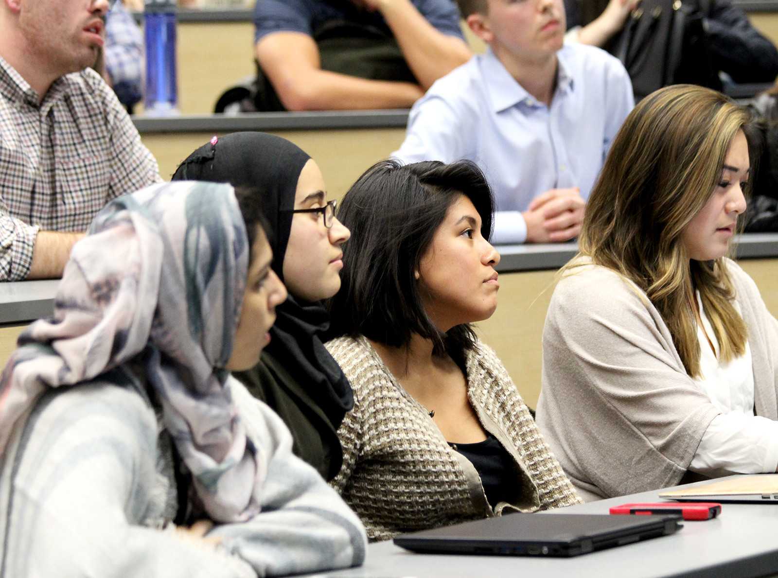 Second from left, Boston University Student Government Vice President of Internal Affairs Marwa Sayed and, third from left, Vice President of Finance Kimberly Barzola wait to hear the verdict on their impeachment during the Student Government Senate meeting Monday night. Senate voted to impeach the E-Board members later that night. PHOTO BY SUSIE TERASAKI/DAILY FREE PRESS STAFF